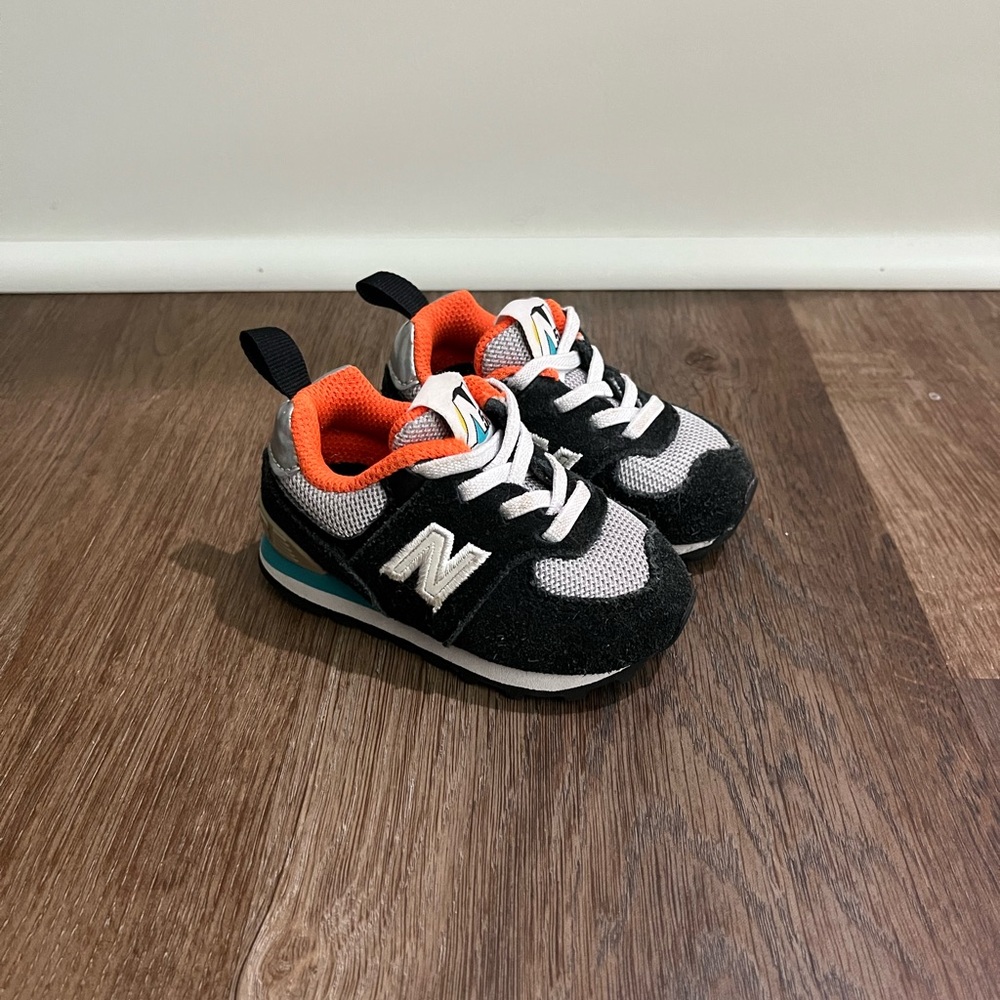 New Balance Baby or Toddler Black and Orange Sneakers
